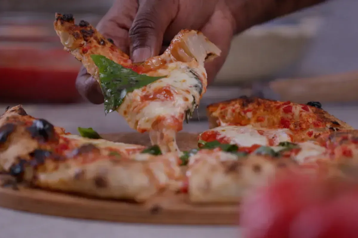 True Neapolitan pizza is beautifully simple: flour, water, salt, yeast. This 48-hour cold ferment develops deep flavor and signature leopard-spotted char.